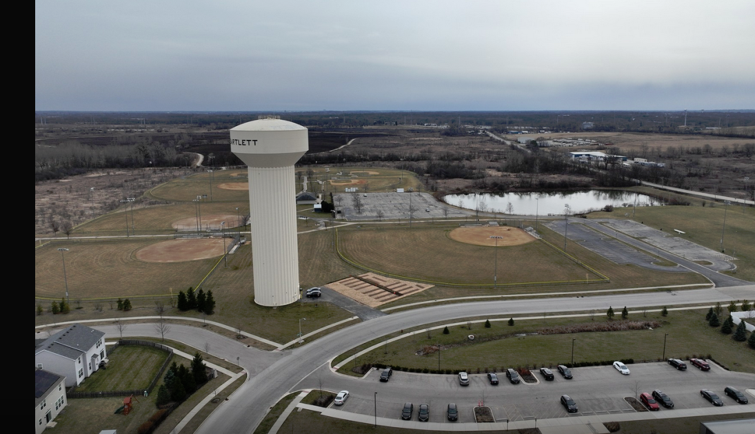 community garden site with water tower