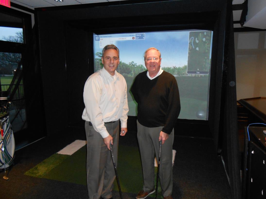 Mayor Wallace & Trustee Deyne test golf simulator